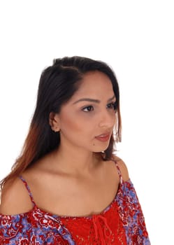 A closeup portrait image of a brunette woman in a colorful, looking.serious away, isolated for white background.