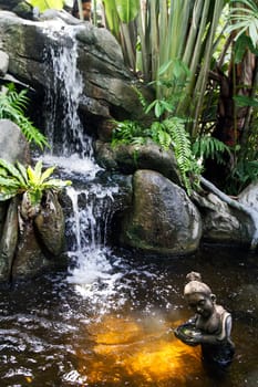 fountain statue rocks cascade