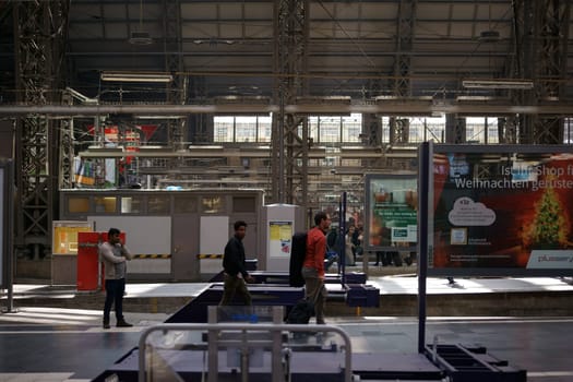Frankfurt,Germany - October 03,2017: The interior shot of Frankfurt Central Station with passengers on the train tracks and advertising on October 3,2017 in Frankfurt.