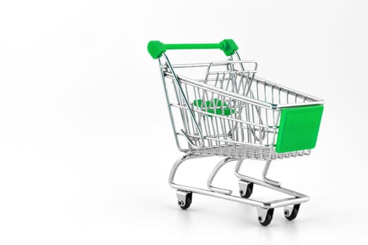 Small metal shopping cart isolated on white background