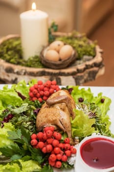quail roasted with sweet and sour cranberry sauce decorated with rowanberry