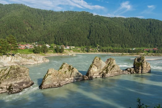 Fast mountain river Katun in Altay, Siberia, Russia. A popular tourist place called the Dragon's Teeth