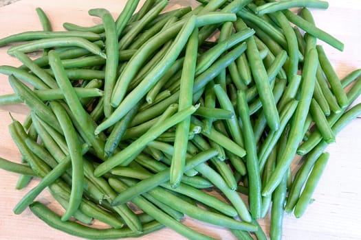 Green String Beans on Chopping Board in Kitchen Closeup Macro