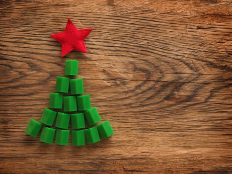 Christmas background with a tree shape on a rustic wooden table