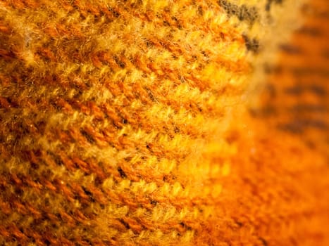 close up of orange fabric knit texture background bright  essex  england  uk