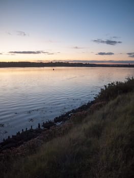beautiful sunset evening bay scene open space water surface waves beach  essex  england  uk