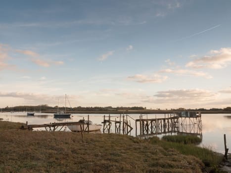 pier harbour boat jetty scene outside bay coast country river lake  essex  england  uk