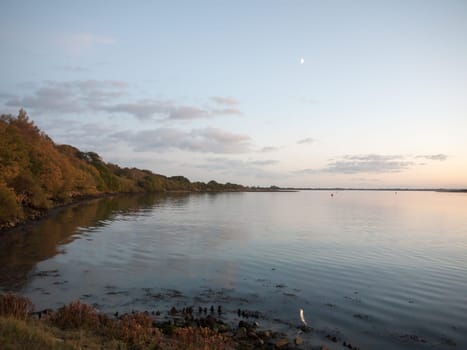 beautiful bay scene with moonlight evening water open space  essex  england  uk