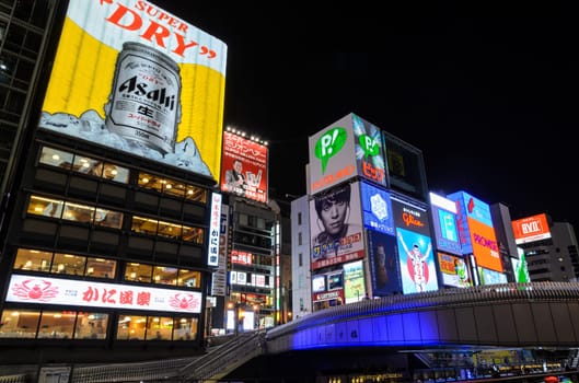 OSAKA, JAPAN - NOVEMBER 23, 2016 : The Aashi Breweries billboard and other illuminated signboards in Dontonbori, Namba area, Osaka, Japan. Dotombori is popular nightlife and entertainment area in Osaka.