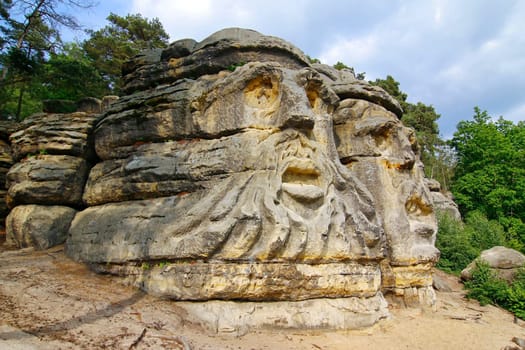 Heads of Devils are about 9 m high rock sculptures of giant heads carved into the sandstone cliffs in the pine forest above the village Zelizy in the district Melnik, Czech republic. It is the work of sculptor Vaclav Levy, who created in the period 1841-1846.