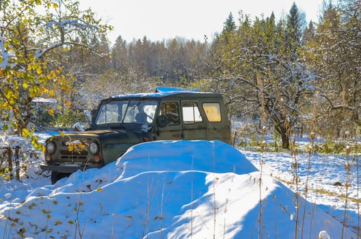 Unattended abandoned car in the woods on the nature