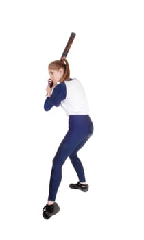 A young slim woman playing softball, swinging her bad to hit the ball.in a blue uniform, isolated for white background.