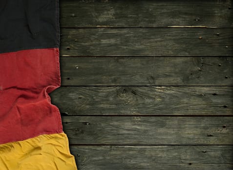 Flag of the Federal Republic of Germany on old wooden boards