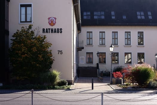 Griesheim,Germany - October 31,2017: The town hall of Griesheim with a front garden and the city coat of arms on the façade on October 31,2017 in Griesheim.