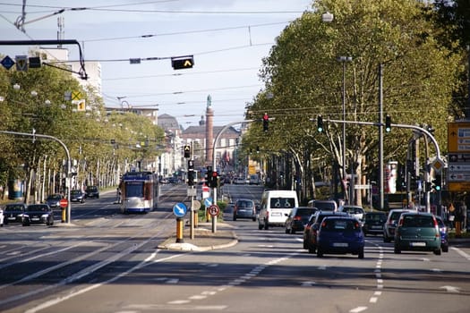 Darmstadt,Germany - October 31,2017: Busy road traffic on Rheinstraße with the Ludwigsmonument in the background on October 31,2017 in Darmstadt.