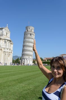 Pisa tower and the church, a girl look like holding the tower