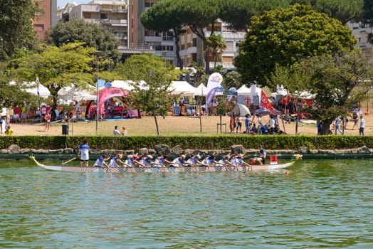 Rome, Italy - July 30, 2016: Dragon boat crews  compete at the european championships held in Italy in 2016 summer, in the photo the UK crew