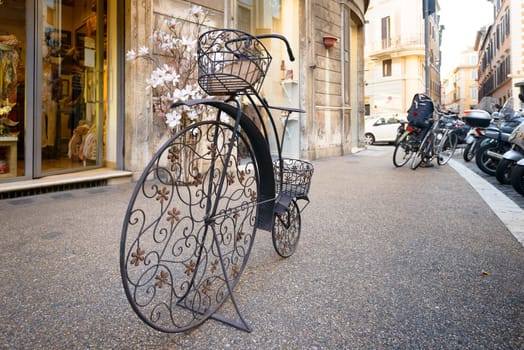 A nice old rusty iron bicycle in a street of Rome
