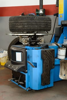 A tire on a fixing machine ready to be fixed