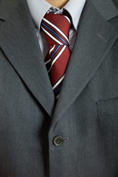 detail of a business man suit with colored tie