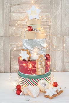 Various cookie jars with cookies stacked into a Christmas tree