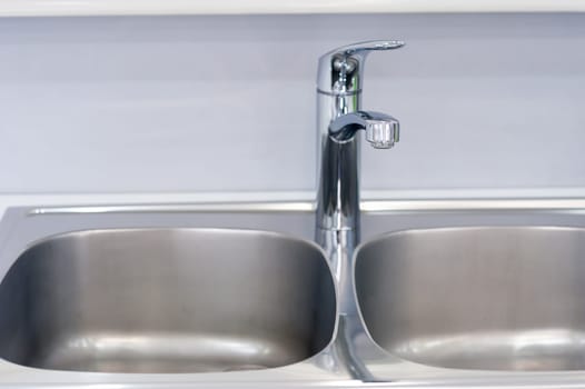 Interior of bathroom with sink basin faucet. Modern design of bathroom.