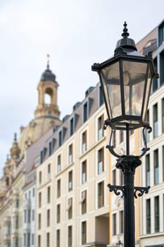 Street lamp in the city center of Dresden in the background the Frauenkirche