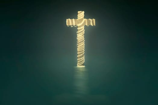 Cross with christmas lights decoration on green background