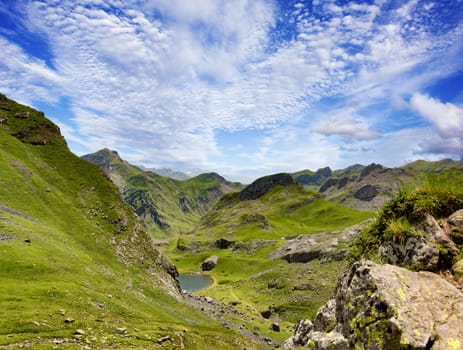 a beautiful landscape of Pyrenees mountains with small lake