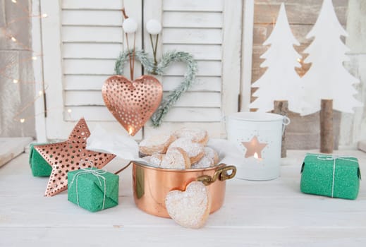 Butter places with icing sugar in heart shape for Christmas