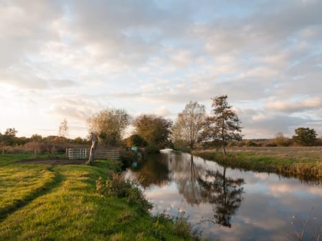 beautiful river stour lake autumn trees reflection countryside  essex  england  uk
