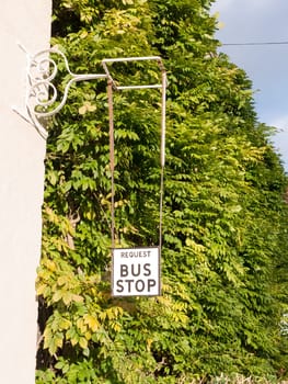 old fashioned retro request a bus stop sign  essex  england  uk