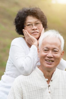 Happy elderly Asian old mature at outdoor park.