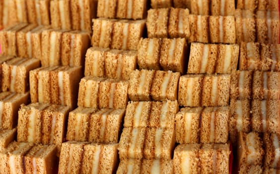 Background with multiple rows of delicious cakes