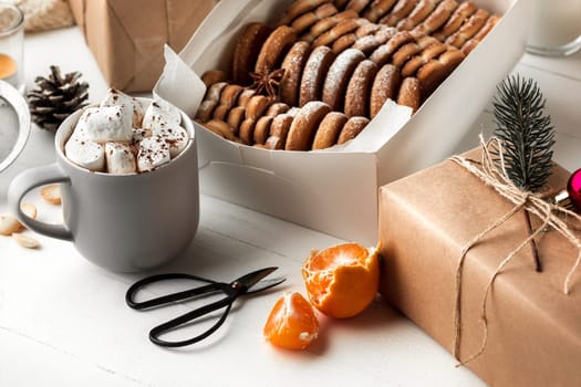 Homemade bakery making, gingerbread cookies in form of Christmas tree and gifts. New year treat for Santa Claus cooking. Homemade bakery, xmas sweet, winter holidays concept.