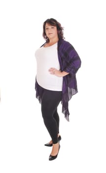 A lovely overweight woman in her forties standing in profile in tights.and white t-shirt, isolated for white background.