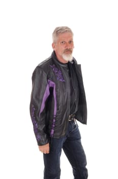 A tall middle age man in a black leather jacket and jeans standing over.white background with a white beard and gray hair.