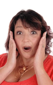 A closeup image of a frightened woman holding her hands on her face.with her mouth open, isolated for white background.