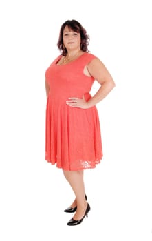 A beautiful woman standing in a red dress in profile in her forties,.isolated for white background.