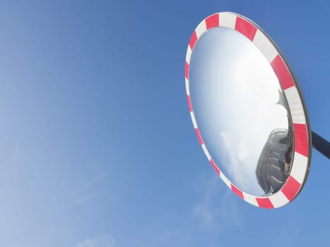 Sky reflection glass. Particular of a round glass, used on the road