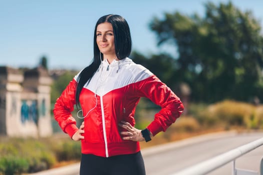 City workout. Beautiful young woman training in an urban setting