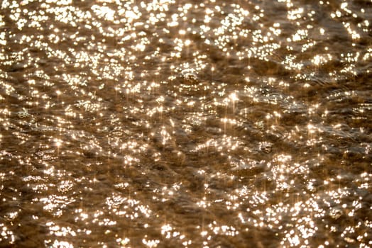 Sea in backlight with sun reflections