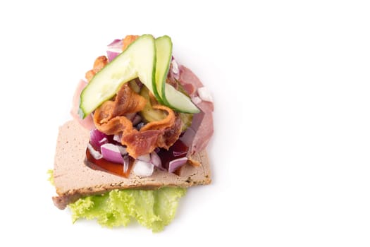 Danish specialties and national dishes, high-quality open sandwich.The very famous piece of butterbread called Veterinarian's midnight snack consisting of liverpostej, jelly and salty Beef meat, isolated on white background
