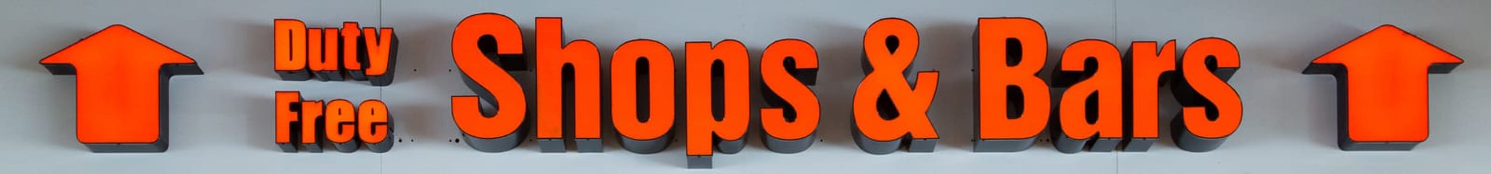 Red neon light as advertisement for a Shop