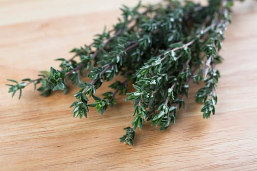 Fresh Thyme on wooden board.