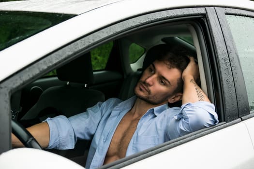 Close up Tired Gorgeous Sexy Man Leaning on Chair While Driving His Nice Car, Shirt Open on Muscular Torso