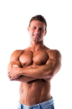 Smiling shirtless muscular young man standing with arms crossed on chest, looking at camera, isolated on white