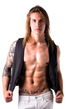 Beautiful young long haired man in jacket on naked torso, serious, posing isolated on white