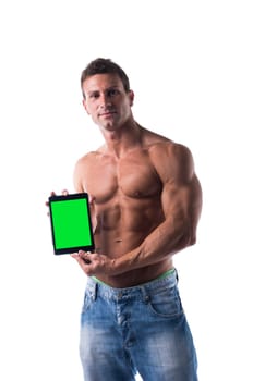 Sexy muscular shirtless young man holding a blank tablet PC while looking at camera, portrait on white