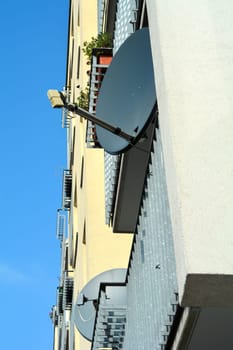 Satellite dishes on the facade of a house jn Berlin